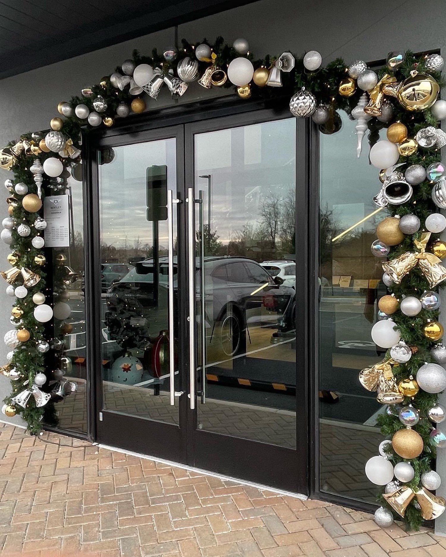 Gold and silver garland arch on commercial glass doors