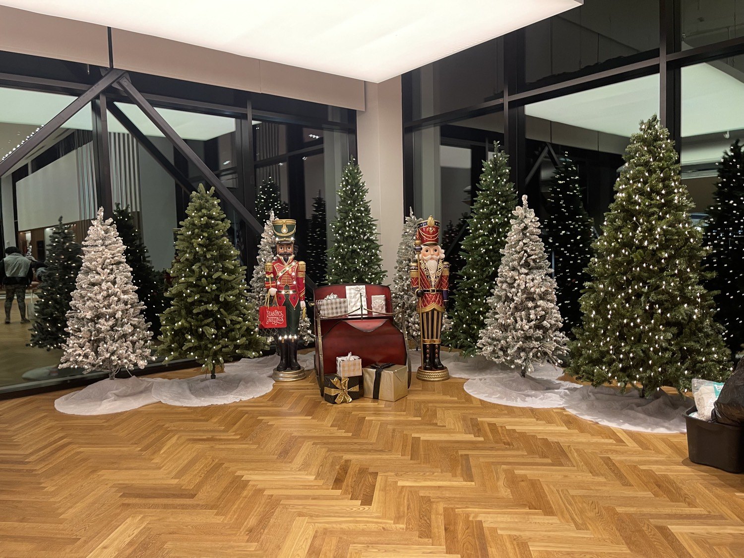 Lobby grove of trees with nutcrackers and sleigh