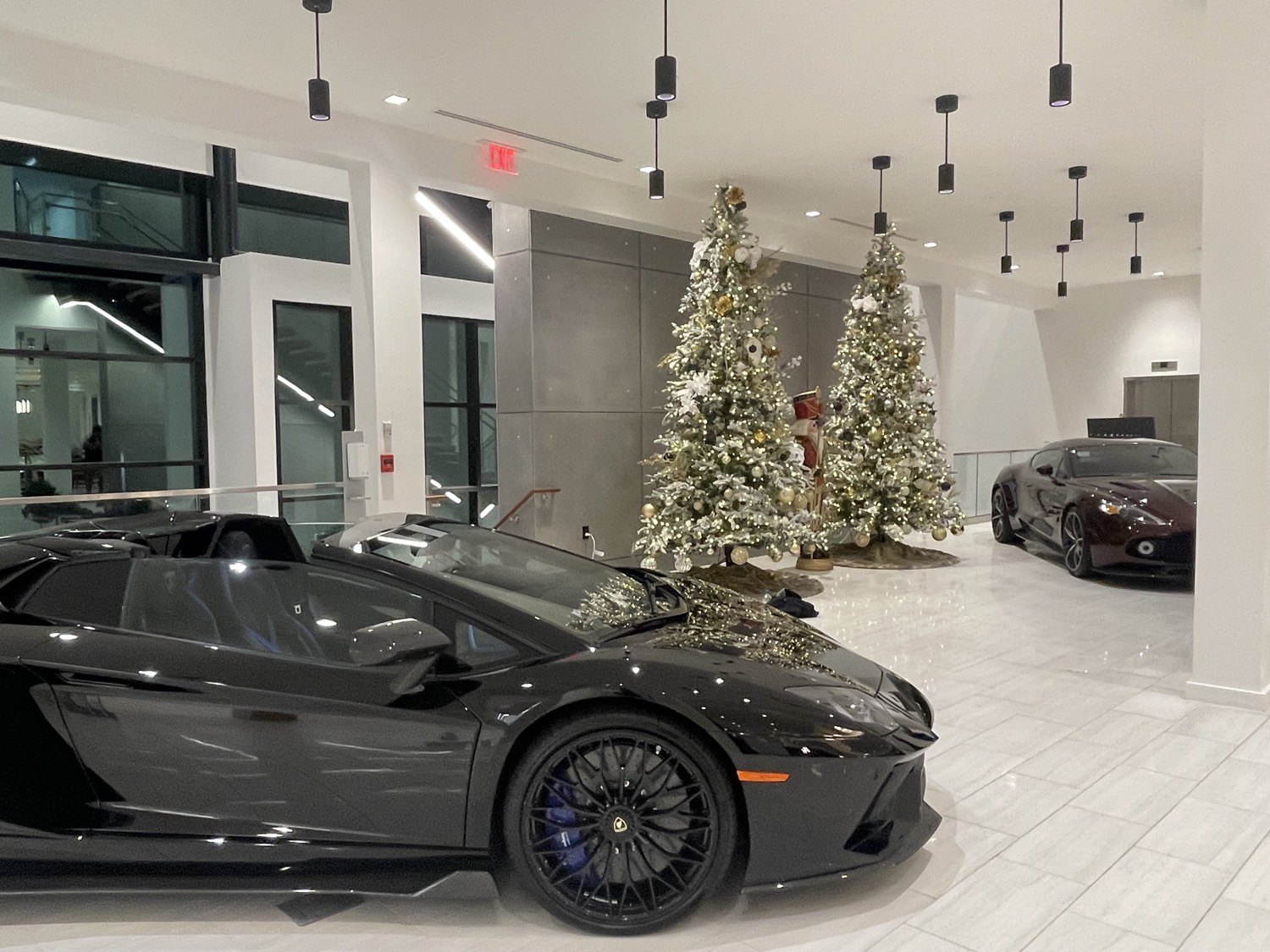 Flocked Christmas trees in an auto showroom